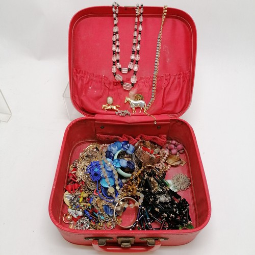 356 - Qty of costume jewellery in a red leather case inc horse brooches, loose hand carved cameo etc