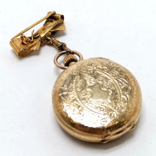 401 - Antique 14ct marked gold outer cased ladies fob watch - 3cm diameter with 9ct marked gold bow suspen... 