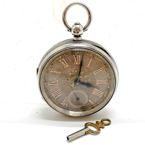 416 - Antique silver cased pocket watch (5cm diameter) with gold arabic numerals to the silvered dial - pa... 