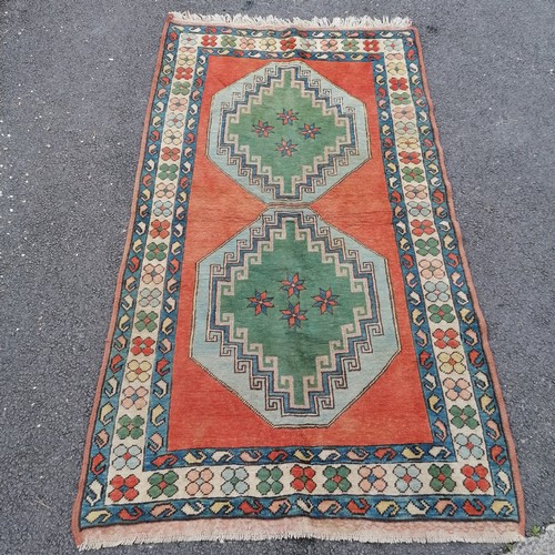 753 - Blue and pink wool rug, 245cm x 135cm, in good used condition.