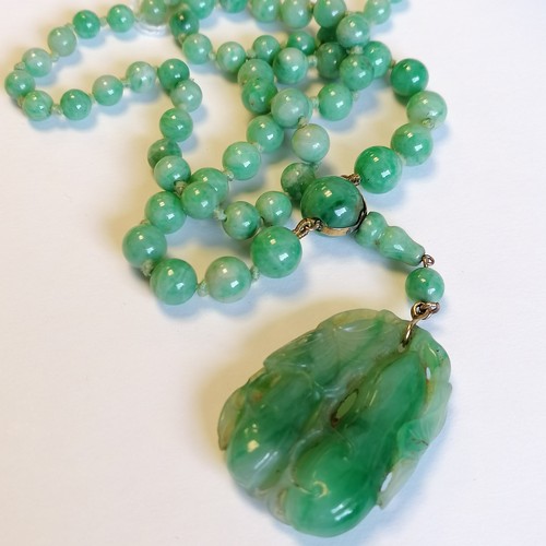 234 - Antique Chinese spinach jade bead (largest bead 10mm in diameter) necklace with a hand carved pendan... 