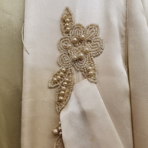 68 - 1930s silk coat with bead work to front, has several stains across front and on sleeves.