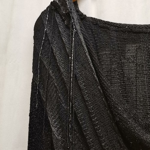 72 - 1980s black knitted dress with bead work to shoulder, chest 82cm.
