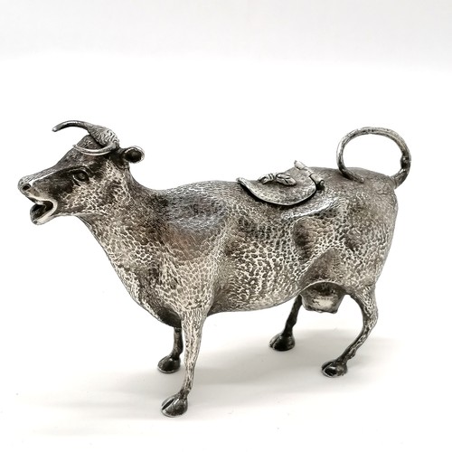 6 - Novelty silver plated cow creamer - 15cm across & 10cm high ~ has old repair to tail & the lid has a... 