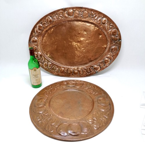 20 - 2 x Newlyn copper wall chargers - largest oval 68cm x 50cm is unmarked - the circular charger (48cm)... 