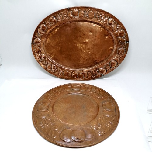 20 - 2 x Newlyn copper wall chargers - largest oval 68cm x 50cm is unmarked - the circular charger (48cm)... 