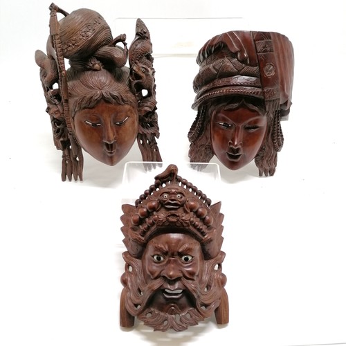 36 - 3 x Chinese carved hardwood masks with glass eyes (1 missing an eye) - largest 30cm x 18cm