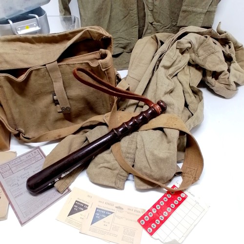 38 - 1943 dated British military bag, 3 khaki shirts (a/f), 2 gas masks, wooden truncheon, booklets, mess... 