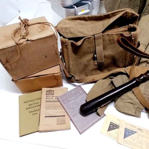 38 - 1943 dated British military bag, 3 khaki shirts (a/f), 2 gas masks, wooden truncheon, booklets, mess... 