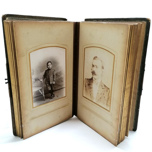 48 - Antique album containing qty of cabinet cards inc gymnast