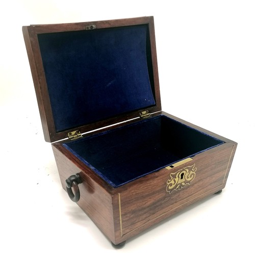 104 - Antique rosewood sewing box with brass inlaid detail, bun feet (1missing) and ring handles with a bl... 