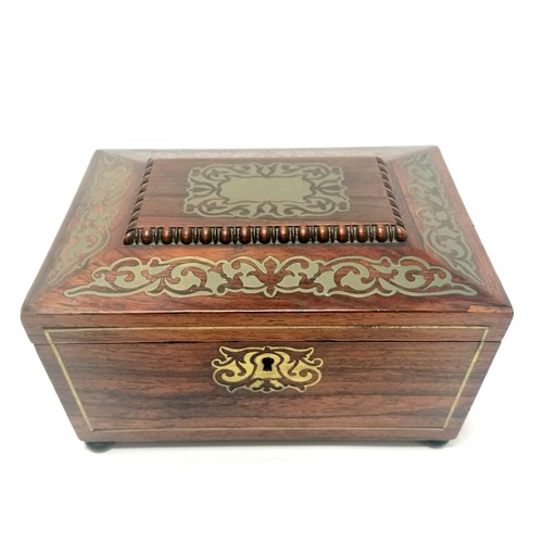 104 - Antique rosewood sewing box with brass inlaid detail, bun feet (1missing) and ring handles with a bl... 