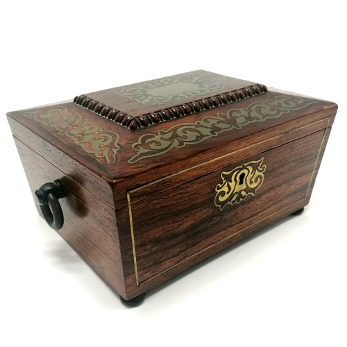 104 - Antique rosewood sewing box with brass inlaid detail, bun feet (1missing) and ring handles with a bl... 