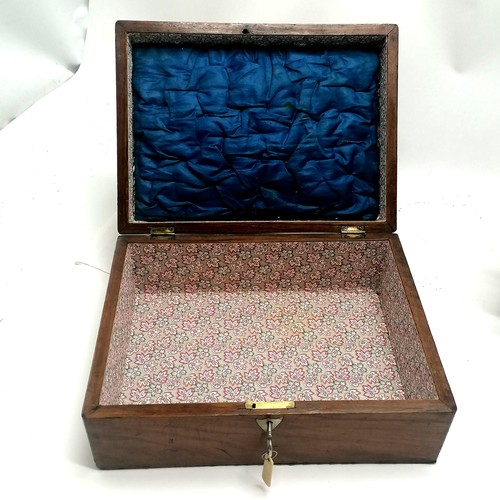 104 - Antique rosewood sewing box with brass inlaid detail, bun feet (1missing) and ring handles with a bl... 