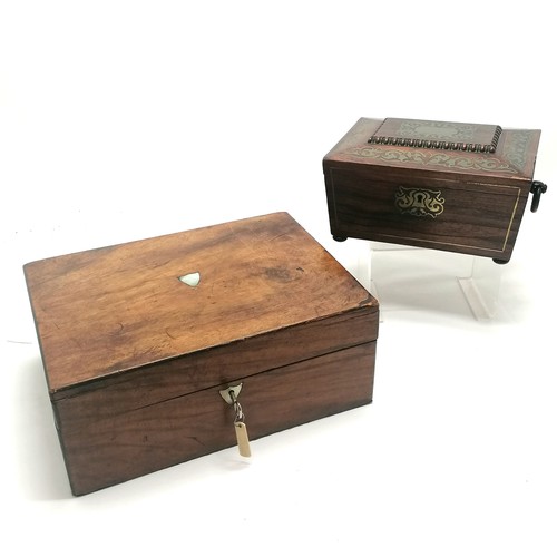 104 - Antique rosewood sewing box with brass inlaid detail, bun feet (1missing) and ring handles with a bl... 