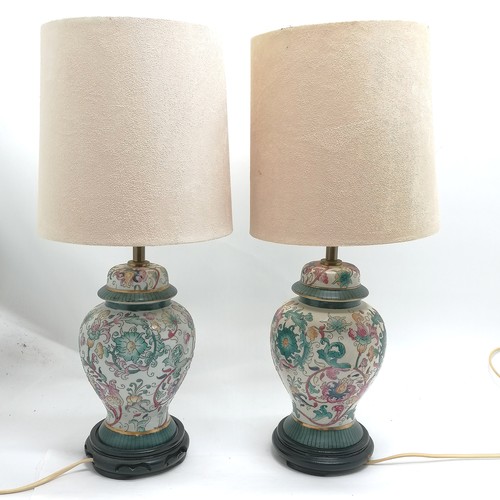 169 - Pair of oriental style baluster china lamps on black turned wooden bases - total height 53cm