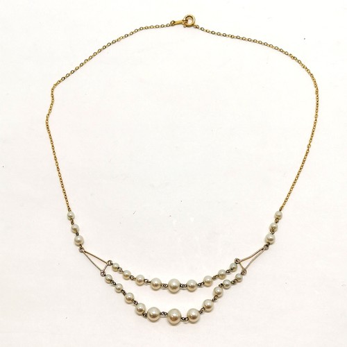 215 - 9ct marked gold necklace with pearl detail and double strand to the drop - 38cm & 5.2g total weight