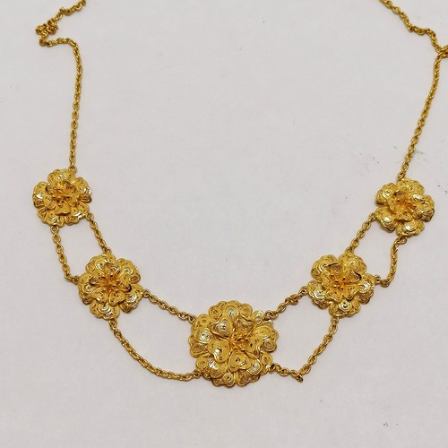 233 - Unmarked (tests as 18ct gold) filigree flower necklace - 38cm & 15.2g