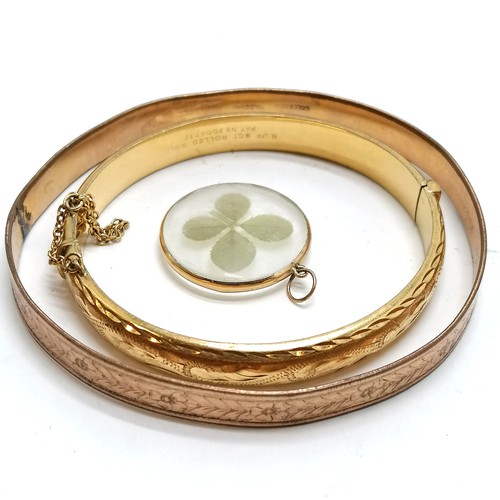 254 - 2 x rolled gold bangles, 4 leaf clover pendant in unmarked gold mount - total weight 29g - SOLD ON B... 