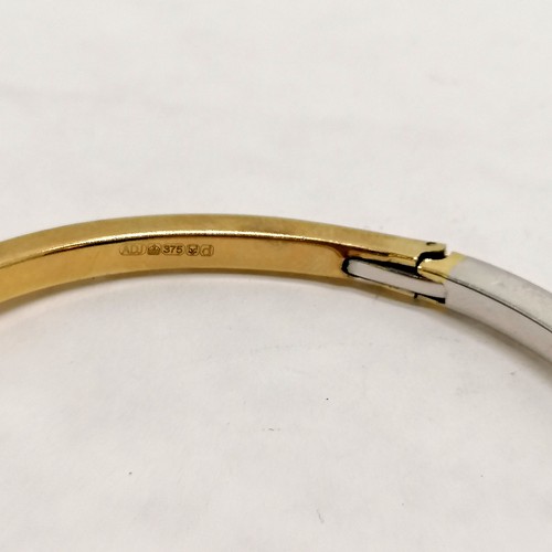 258 - 9ct hallmarked gold white / yellow gold crossover hinged bangle - 11.8g total weight - SOLD ON BEHAL... 