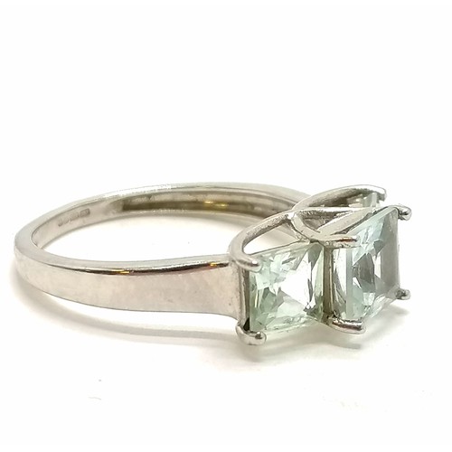 290 - 9ct hallmarked white gold 3 x pale blue princess cut stone ring - size O & 2.6g total weight