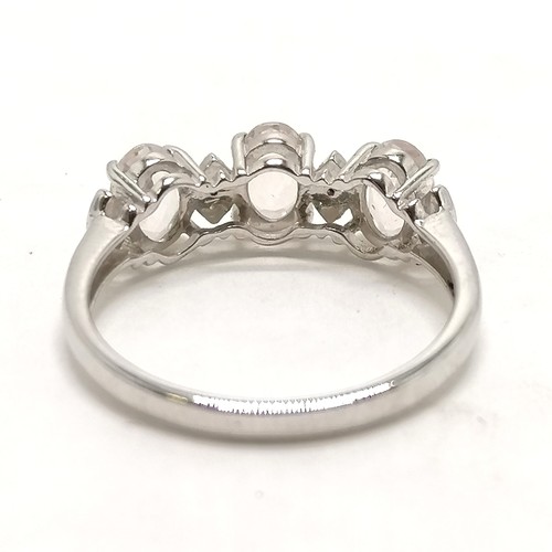 292 - 9ct hallmarked white gold 3 x oval white stone ring (with 4 diamonds set between) - size N½ & 2.2g t... 