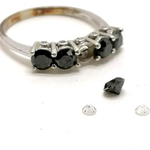 296 - 9ct white gold 5 stone black diamond ring with unusual 10 diamonds set into the sides of the crown -... 