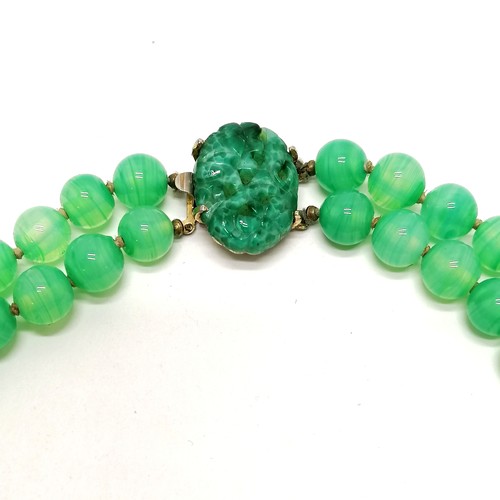 306 - Long 2 strand Chinese peking glass green bead necklace (60cm) t/w hardstone panel, 3 bangles etc