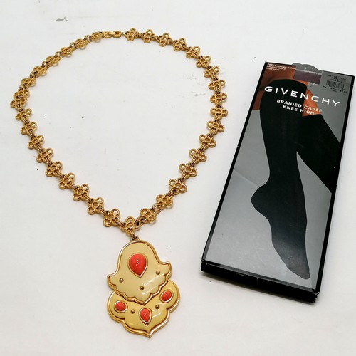 310 - Givenchy 1977 dated gold tone pendant / necklace (68cm) t/w Givenchy unbraided cable knee highs (in ... 