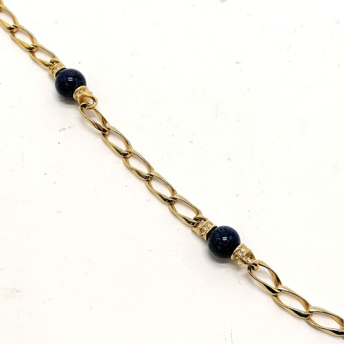 315 - Christian Dior gold tone blue bead (& white stone spacers) necklace (76cm) - in good used condition