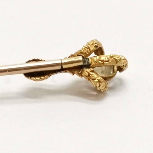 334 - 2 x unmarked gold stick pins - largest 8.5cm touch tests as 18ct gold and has a claw holding a diamo... 