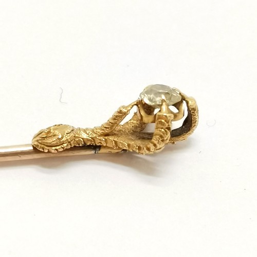 334 - 2 x unmarked gold stick pins - largest 8.5cm touch tests as 18ct gold and has a claw holding a diamo... 