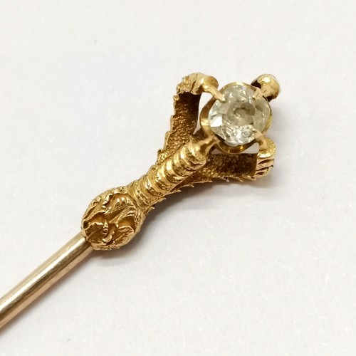 334 - 2 x unmarked gold stick pins - largest 8.5cm touch tests as 18ct gold and has a claw holding a diamo... 