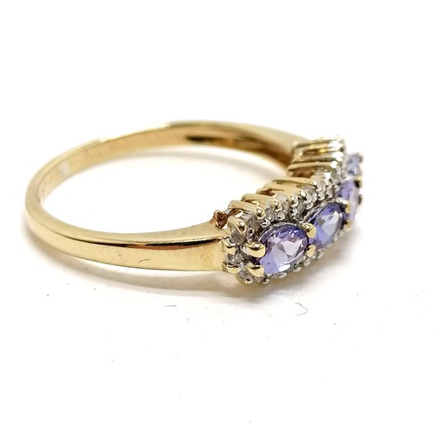 376 - 9ct hallmarked gold tanzanite (4 oval stones) & diamond ring - size P½ & 2.2g total weight