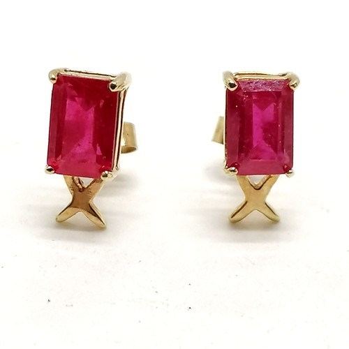 378 - 9ct marked gold ruby earrings - 0.9g total weight - rubies approx 6mm x 4mm