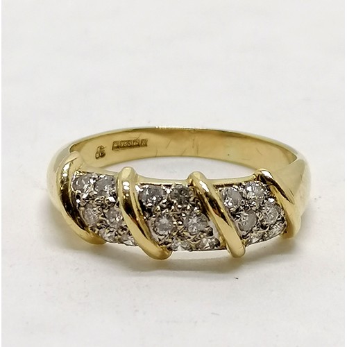 379 - 18ct hallmarked gold ring set with 18 diamonds in 3 panels - size Q½ & 4.4g total weight