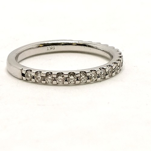 385 - 9ct hallmarked white gold diamond set half eternity ring - size O & 2.4g total weight (0.5ct total d... 