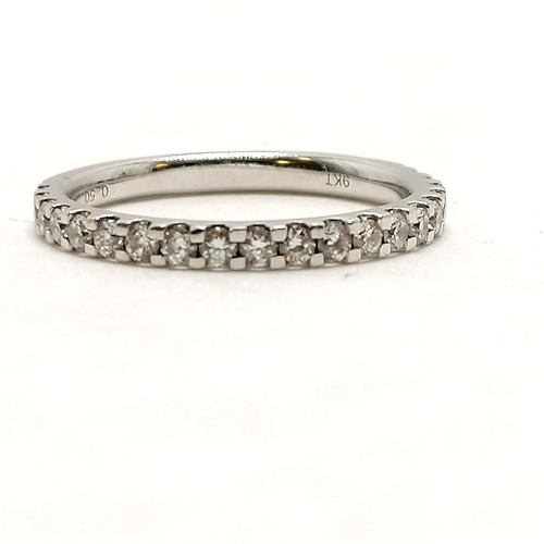 385 - 9ct hallmarked white gold diamond set half eternity ring - size O & 2.4g total weight (0.5ct total d... 