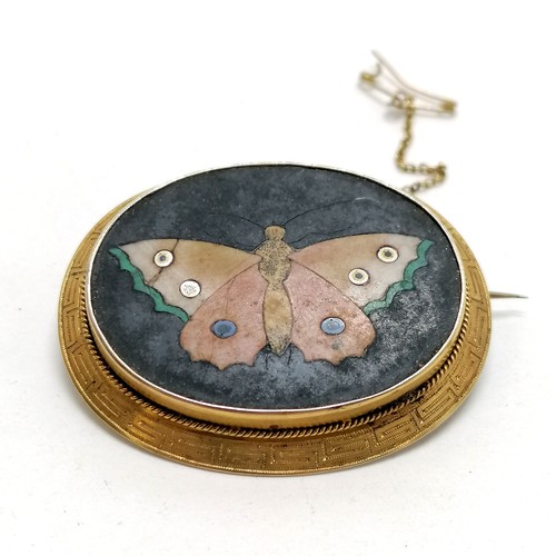 397 - Antique pietra dura butterfly panel unmarked gold brooch with Greek key pattern around the rim and h... 