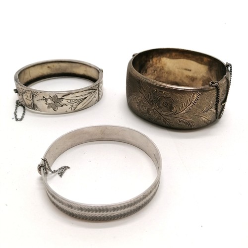 407 - Victorian silver buckle design bangle, Patented nymph engine turned silver bangle, flower engraved w... 