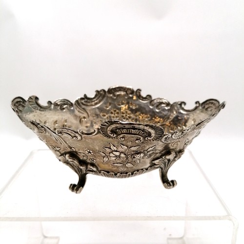 454 - Continental silver embossed bon-bon dish on 4 cast feet - 14cm across x 5.5cm high & 132g