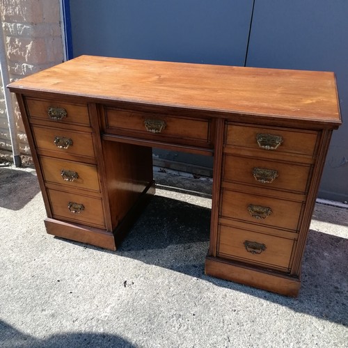 Edwardian mahogany pedestal desk on castors. 122cm wide x 85cm deep x