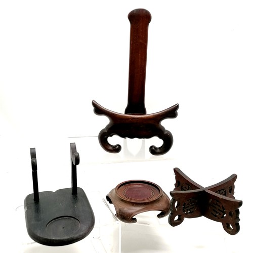 15 - Quantity of mostly Oriental wooden stands, tallest 27cm high,