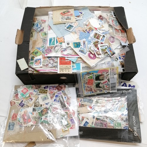 96 - Box of mostly loose stamps (1000's) + the odd postcard / cover etc - 3.4kgs total weight