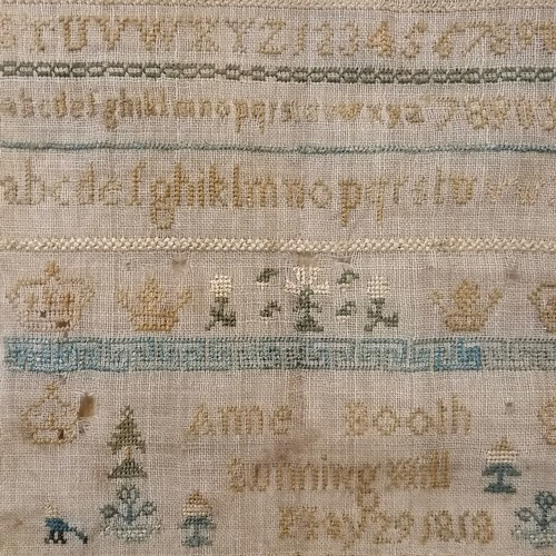 100 - Small maple framed sampler dated 1818 by Anne Booth Sunning Hill - frame 21cm square ~ has some smal... 