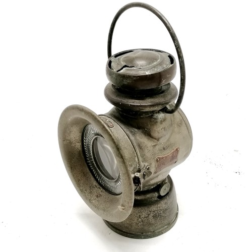 137 - King Road Lucas no.75C motoring oil lamp. 32cm to top of handle. Has a fracture rto the top and old ... 