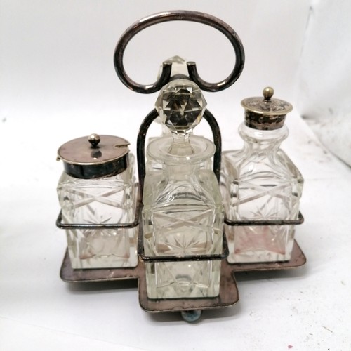 140 - Silver plated cruet set on stand, silver topped castor, vase, and silver collared scent bottle. T/w ... 