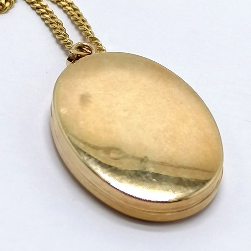 231 - 9ct marked gold locket on a 9ct gold 54cm chain - total weight 8g