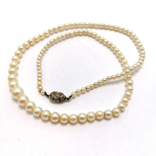 268 - 40cm strand of graduated cultured pearls with unmarked white metal diamond set clasp - SOLD ON BEHAL... 