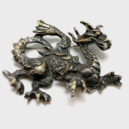 272 - Heavy cast silvered bronze (?) dragon brooch - 5cm across & 28g - SOLD ON BEHALF OF THE NEW BREAST C... 